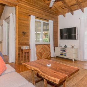 A living room with wooden floors and walls