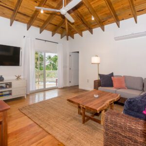 A living room with wooden floors and ceiling