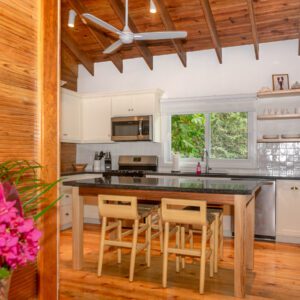 A kitchen with wooden floors and walls.