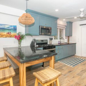 A kitchen with a table and chairs in it